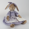 Burrowfolk rabbit, Fern, wearing her violet dress and holding her apron.