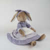 Burrowfolk rabbit, Fern, sitting in her violet dress and bow.