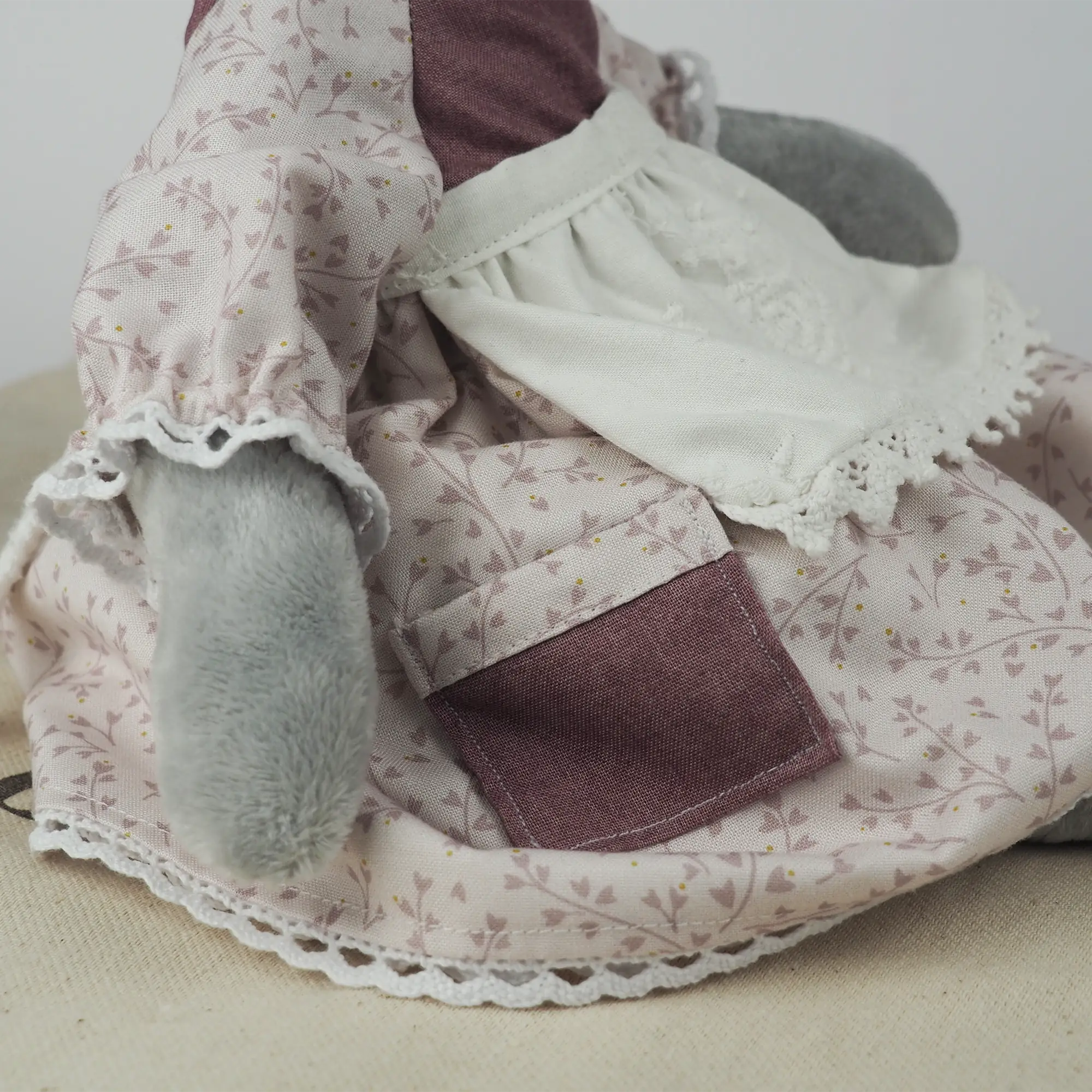 Close up of Burrowfolk rabbit, Flossie's dress showing picket and lace details.