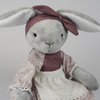 Close up of Burrowfolk rabbit, Flossie's face and bow detail.